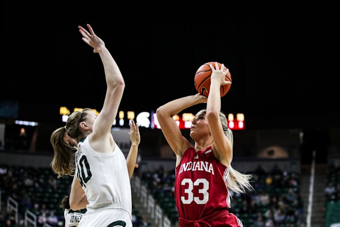 Indiana's Sydney Parrish (33) shoots over Michigan State's Julia Ayrault (40) in the Hoosiers, Spartans contest on Dec. 29 in East Lansing, Mich.